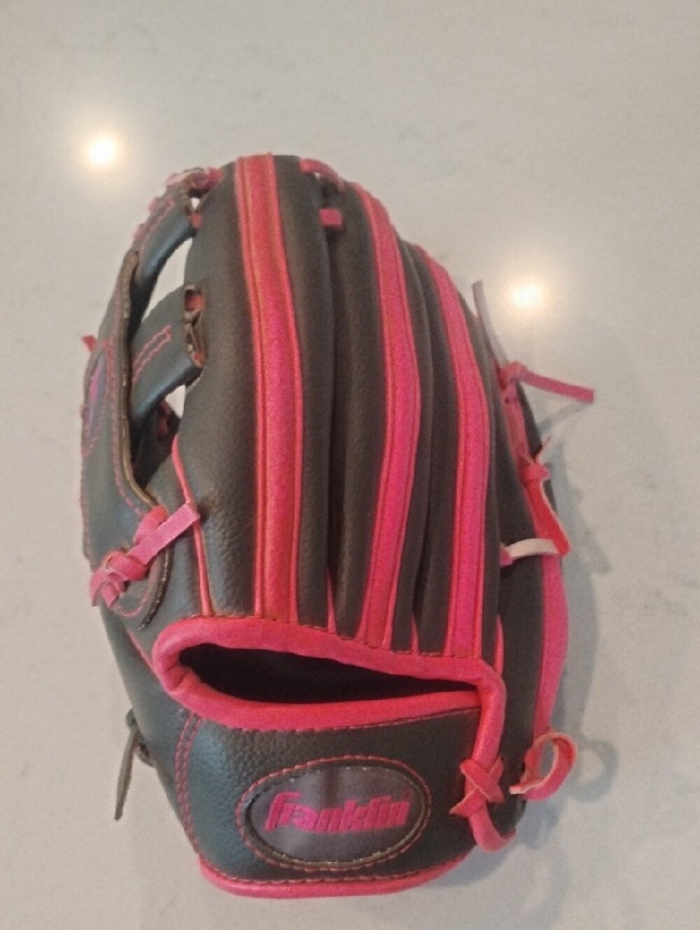 Left-Hand Throwers Franklin Youth Baseball Glove in Gray with Pink Lacing